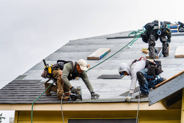 Professional Roofing technician working in Glen, NH